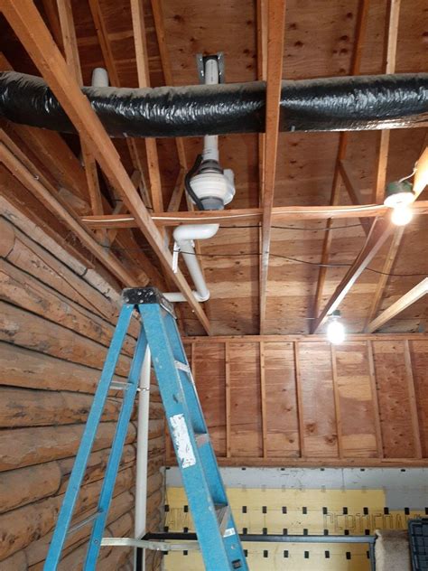Radon mitigation involves depressurizing the soil below a slab or plastic covering, not just exhausting bulk air. Radon Mitigation System - Fluctuating Levels Become Low Levels in Sioux Rapids, IA - Garage Open ...