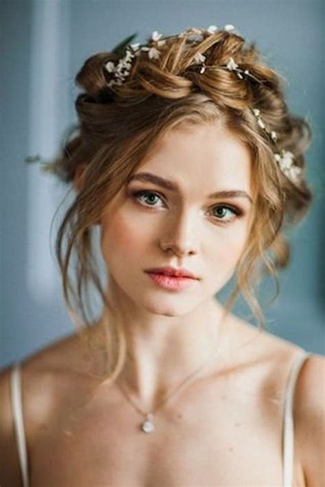 We love a waterfall of wavy hair because it will never go out of style! Braided Crowns Hairstyles For the Summer Bride - Arabia ...