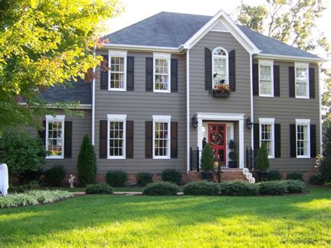 Accenting This Grey House With Blackdark Shutters Is A Perfect