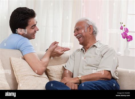Grandson And Grandfather Talking Stock Photo Alamy
