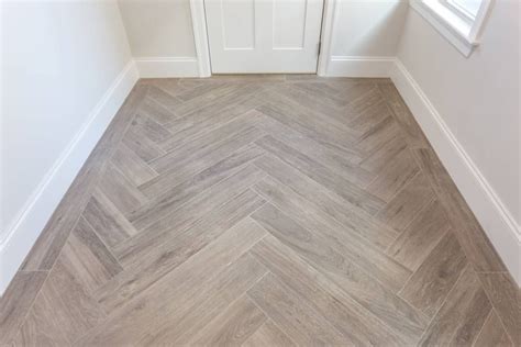 Wood Looking Tile Installed In A Herringbone Pattern With A Single Row
