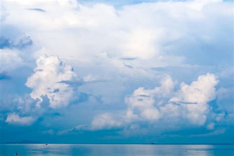 White Cloud In Summer Clear Blue Sky Background Over Sea Stock Photo