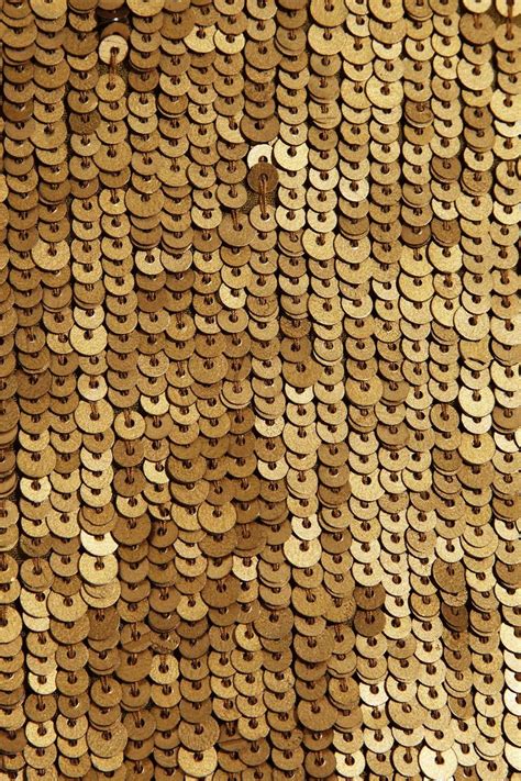 An Image Of Gold Sequins That Are On The Side Of A Wall Or Floor