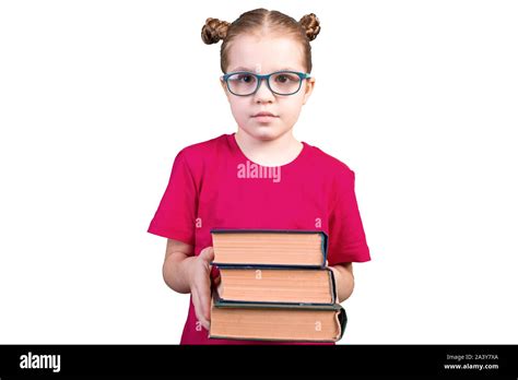 A Girl With Glasses Holds A Stack Of Old Books Isolated On A White