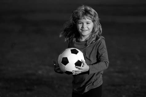Premium Photo Soccer Kid Kid Holding Soccer Ball Closeup Kids