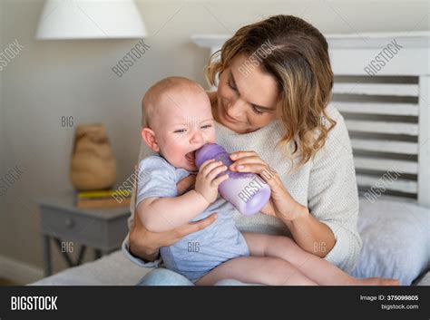 Mother Holding Feeding Image And Photo Free Trial Bigstock