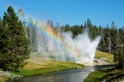 Riverside Geyser Rainbow At Yellowstone National Park Stock Photo
