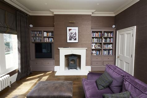 Chocolate Brown Wallpaper And A Purple Sofa Create A
