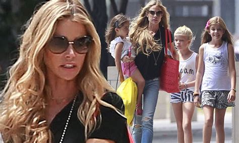 Denise Richards Carries Daughter Eloise In Her Arms On Outing With Her
