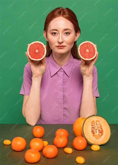 Free Photo Beautiful Redhead Woman Posing With Fruits