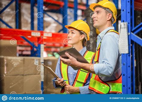workers working in warehouse manager and supervisor taking inventory in warehouse female