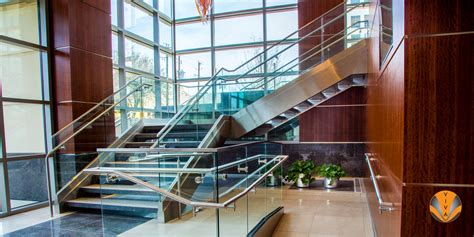Modern staircase aluminum railing system. Glass Railing System | Terraces at Douglass Dallas - SHOE™