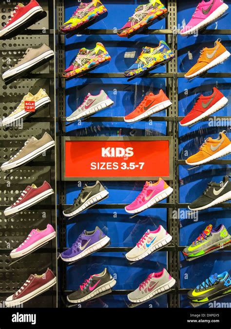 Nike Kids Sizes 35 7 Athletic Shoe Wall Foot Locker Stock Photo