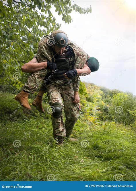 The Commander Carries A Wounded Soldier Stock Image Image Of Conflict