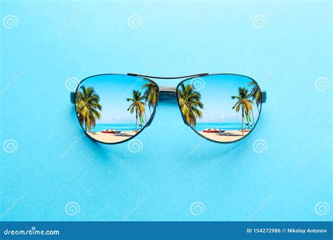 Summer Vacation Concept Sunglasses With Ocean Beach And Palms On Blue