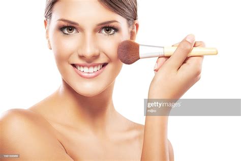 Young Woman Applying Makeup On Face High Res Stock Photo Getty Images