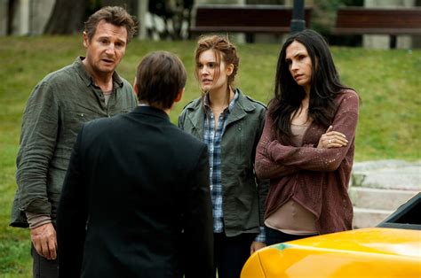 The rear window of the taxi is intact again after getting. Liam Neeson, Maggie Grace and Famke Janssen in Taken 2 ...