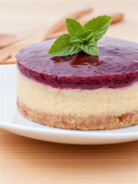 Blueberry Cheesecake With Fresh Mint Leaves On Wooden Background Stock