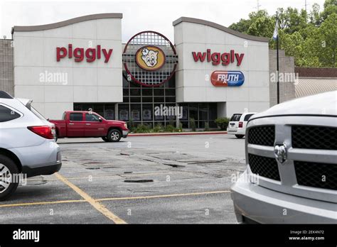 A Logo Sign Outside Of A Piggly Wiggly Retail Grocery Store Location In