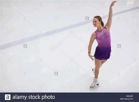 Female Figure Skater Performing Routine In Skating Rink Stock Photo Alamy