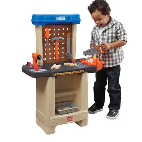 This is a woodworker's dream, complete with a real vise and a spinning table saw. Handy Helper's Workbench Play Set-836800 - The Home Depot