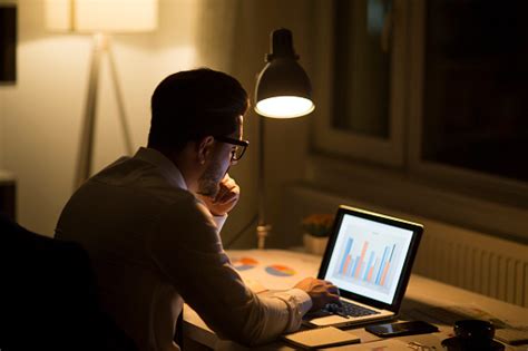 Man Working With Laptop Late At Night At Home Stock Photo Download