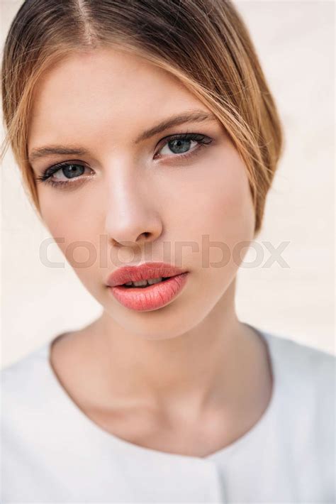 portrait of beautiful blonde woman posing in white clothes stock image colourbox