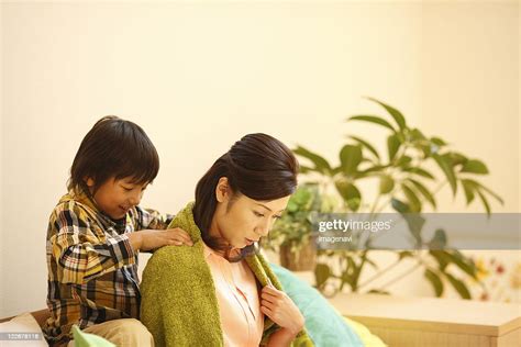 Son Massage Mothers Shoulders Photo Getty Images