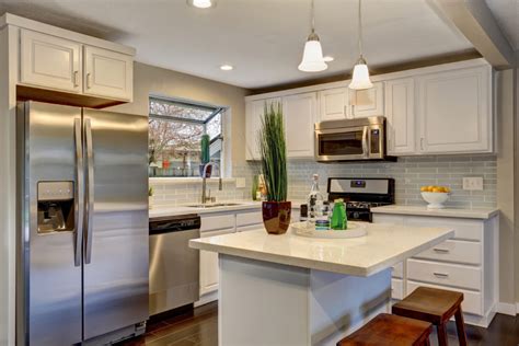 A little bit of paint and a whole lot of tile took this kitchen from drab and dreary to chic as can be. How To Maximize Space In A Small Kitchen! - Bianco Renovations