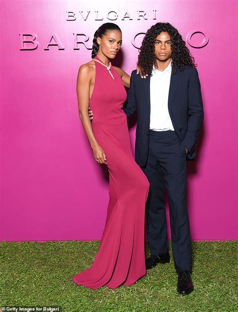 Vincent Cassels Wife Tina Kunakey Exudes Glamour In A Fuchsia Gown At