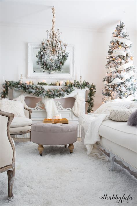 All it takes to complete the look is a classic pine garland, a bowl of festive fruits, and some twinkling tea lights. Elegant and Simple Christmas Living Room in White | Shabbyfufu