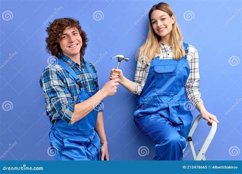 beautiful couple of constructors foremen man and woman in uniform repairing stock image image