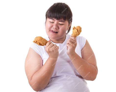 Premium Photo Fat Asian Woman Holding And Eating Fried Chicken