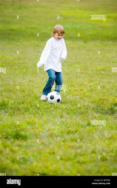 Boy Playing Soccer Stock Photo Alamy