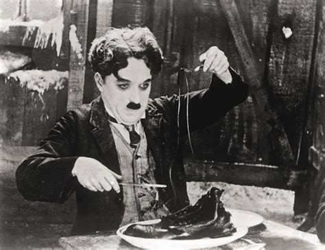 1920s Charles Chaplin Eating Shoe In Scene From 1925 Film The Gold Rush