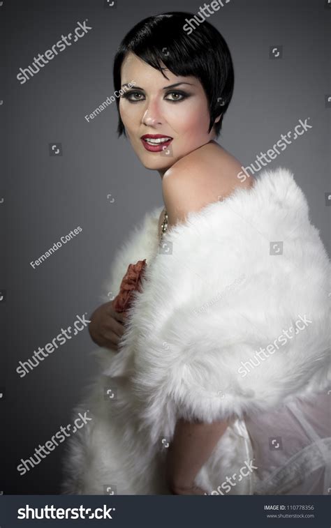Sensuous Short Haired Brunette Woman Bare Shoulders With White Fur