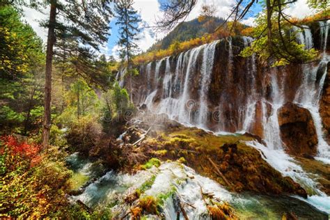 The Nuo Ri Lang Waterfall Nuorilang Among Autumn Woods Stock Photo