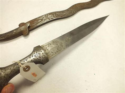 An Indian Sword 735cm Wavy Blade Decorated To Either Side With