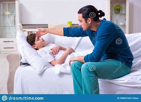Young Father Caring For Sick Son Stock Photo Image Of Coughing High