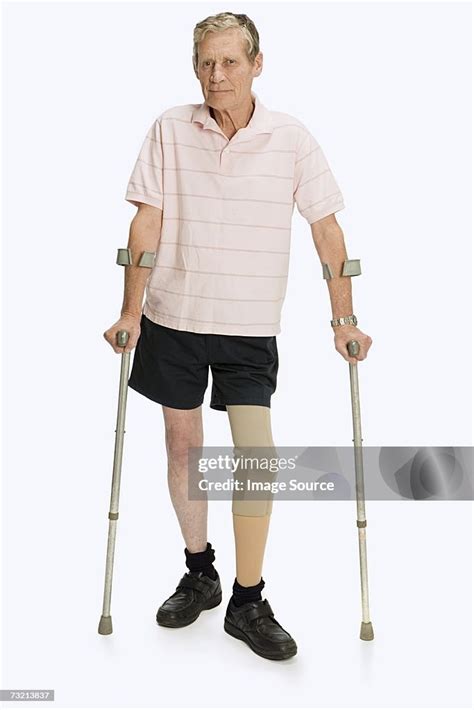 Male Amputee Using Crutches High Res Stock Photo Getty Images