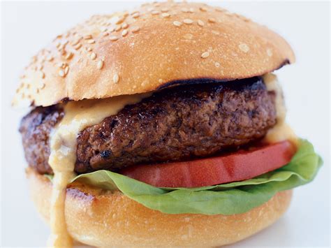 These homemade burgers are so juicy and meaty with the best homemade mayo that you have ever had on top! Classic Beef Burgers Recipe - Steven Raichlen | Food & Wine