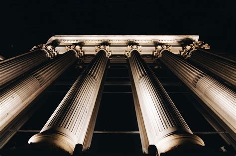 Download Courthouse Tall Pillar At Night Wallpaper