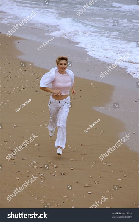 Beautiful Mature Women Running On Beach Stock Photo Shutterstock