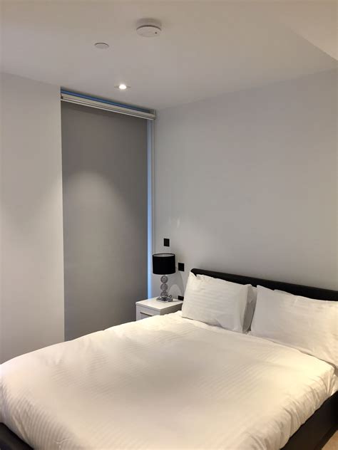 Product information about roller blinds, photo roller blinds will enhance the look of your room, reduce heat and glare, whilst assisting in heat. Double/dual roller blinds showing the blackout blind down ...