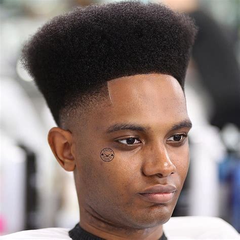 It's not the only way to cut curly hair for men but it's a good one. High-Top Fade Haircuts For Men | Hairstylo