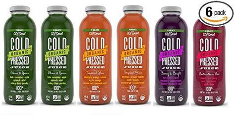 Six Bottles Of Cold Pressed Juice Are Lined Up