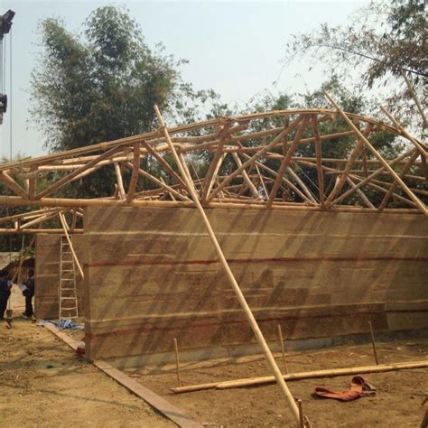 We Lifted The Bamboo Roof Trusses By Crane Onto The Rammed Earth Walls