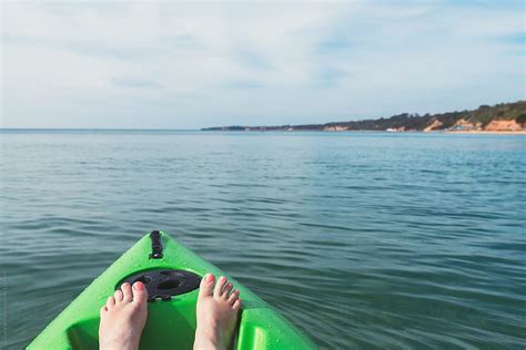 Womans Feet In Kayak In The Ocean By Stocksy Contributor Gillian
