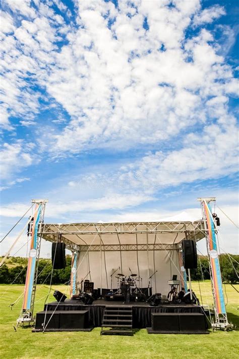 Small Outdoor Concert Venue Stage And Lighting In A Empty Field