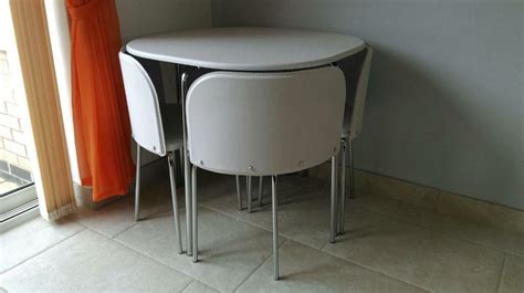 It's both a coffee table and a bed. Hygena amparo space saving dining table & 4 chairs | in ...